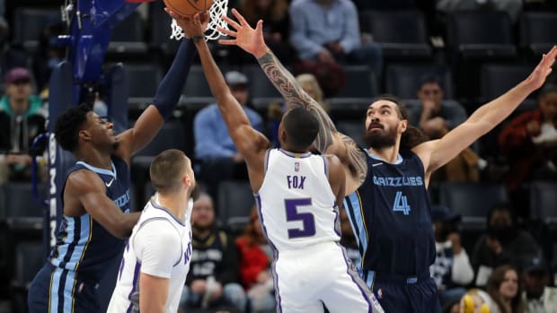Nov 28, 2021; Memphis, Tennessee, USA; Memphis Grizzles forward Jaren Jackson Jr. (13) and Memphis Grizzles center Steven Adams (4) defend Sacramento Kings guard De'Aaron Fox (5) during the second half at FedExForum. Mandatory Credit: Petre Thomas-USA TODAY Sports
